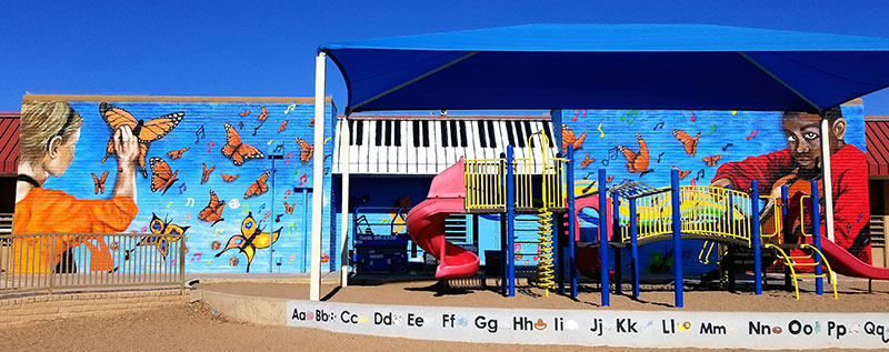 Hugo Medina, Highland Arts Academy Mural, 2020. Exterior latex and aerosol on wall. [3042 E Adobe St., Mesa, AZ 85213]